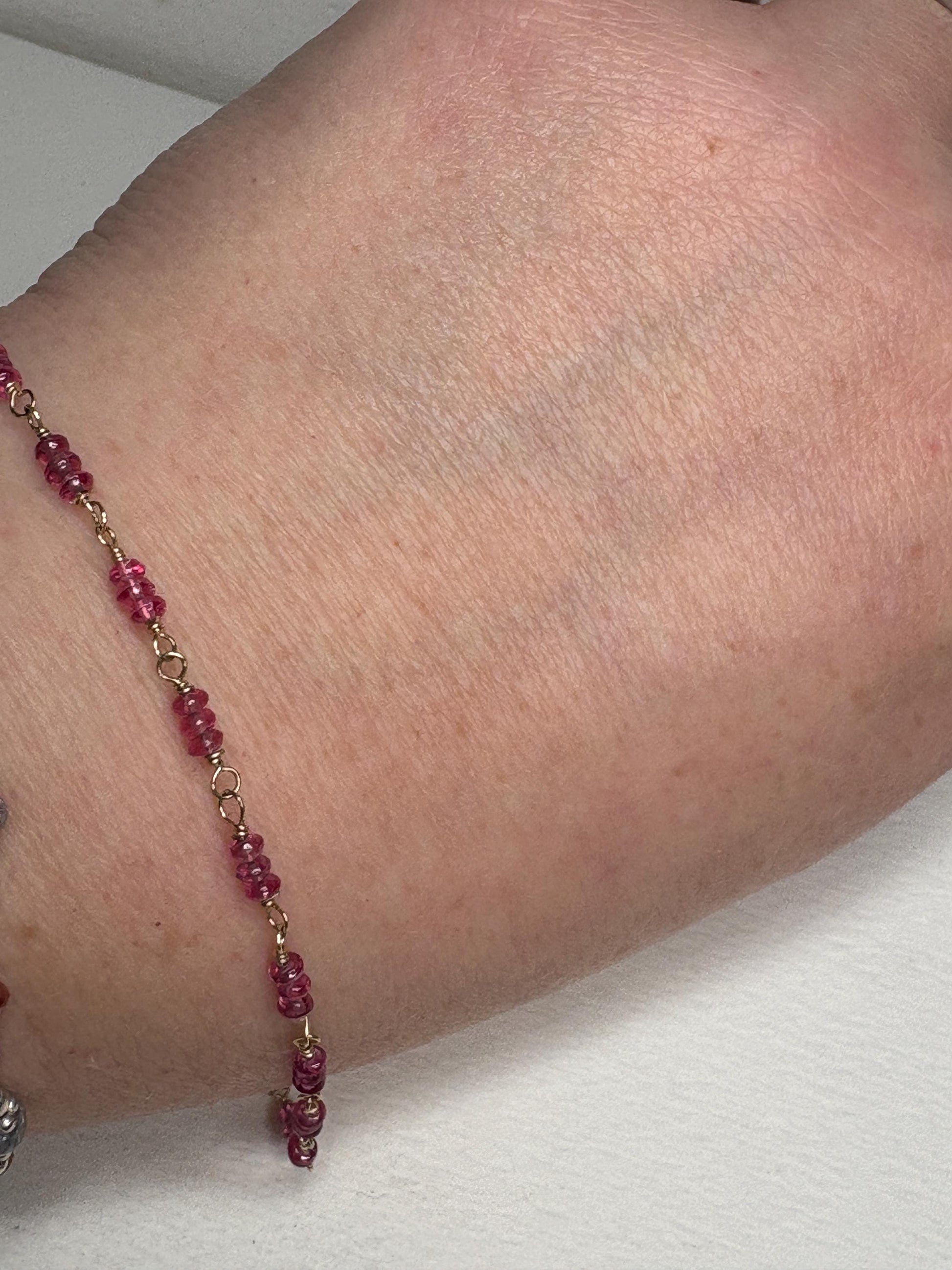 Natural hot pink spinel beaded bracelet in solid 14k gold.