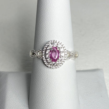 Oval pink sapphire and zircon double halo ring in sterling silver.