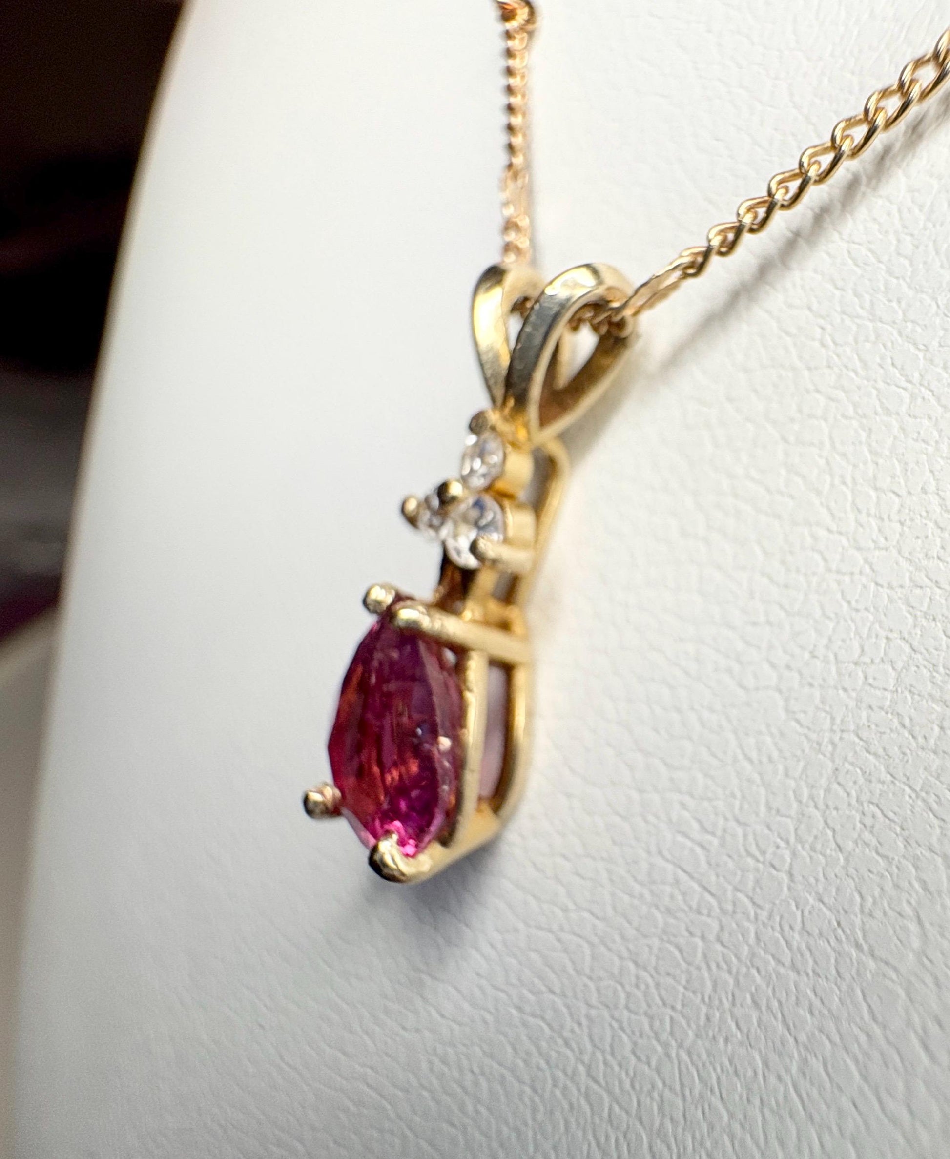 14k gold necklace with a pear-shaped rubellite tourmaline and diamond pendant.