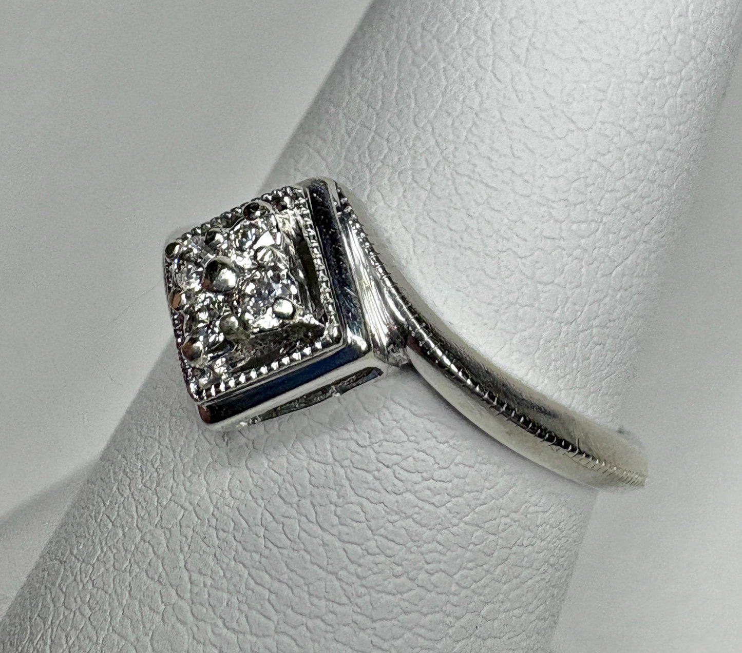 Natural diamond square cluster ring with milgrain detail in 10k white gold.