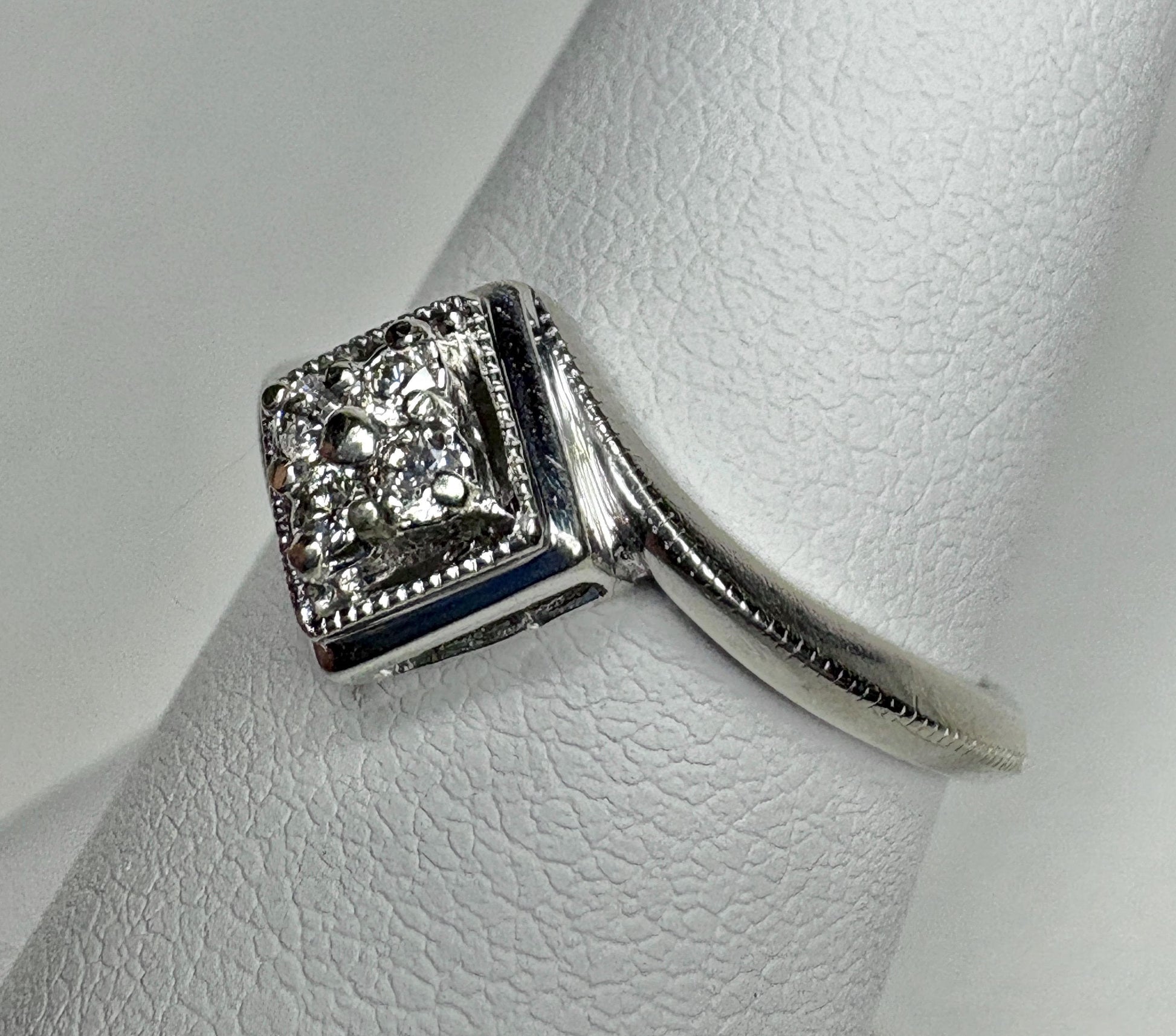 Natural diamond square cluster ring with milgrain detail in 10k white gold.