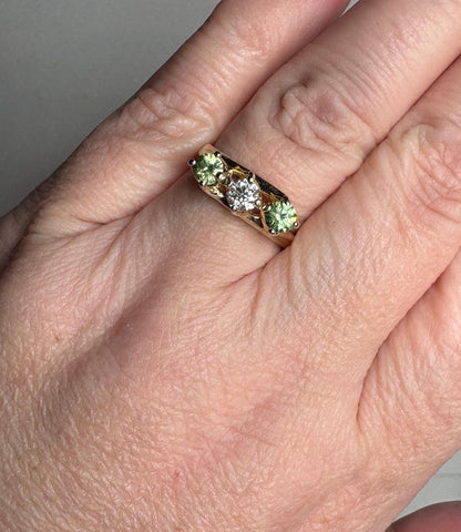 Vintage 10k gold ring with a diamond and two demantoid garnets.