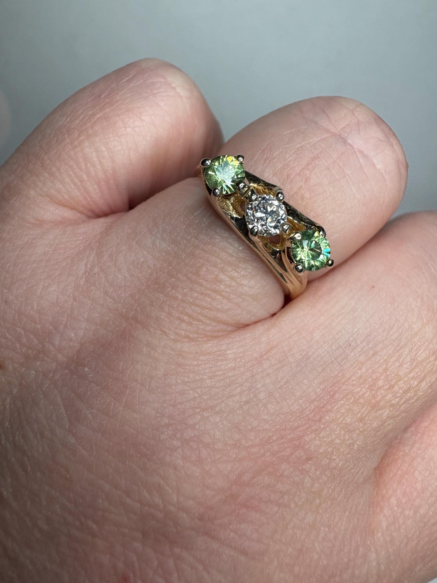 Vintage 10k gold ring with a diamond and two demantoid garnets.