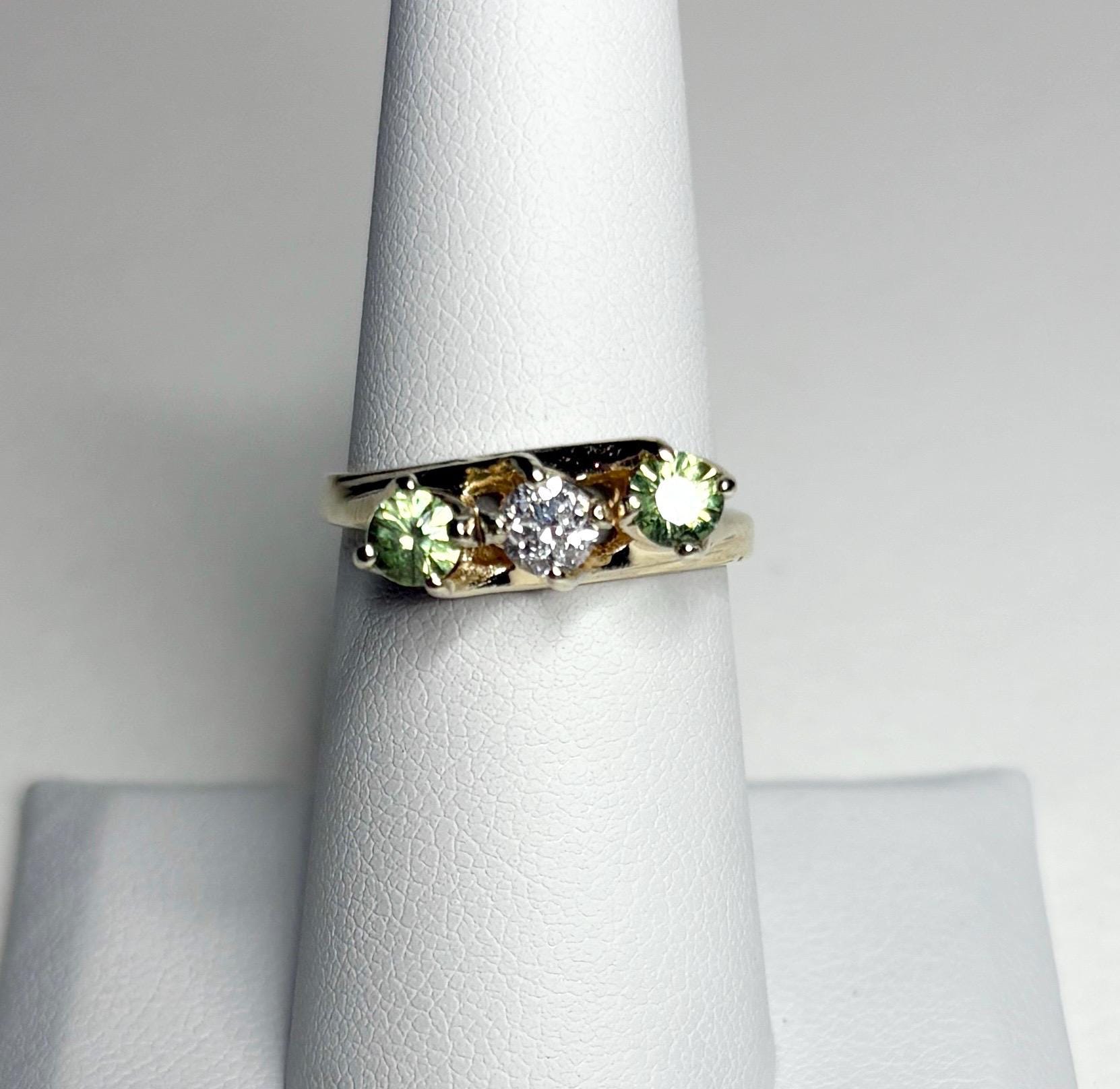 Vintage 10k gold ring with a diamond and two demantoid garnets.