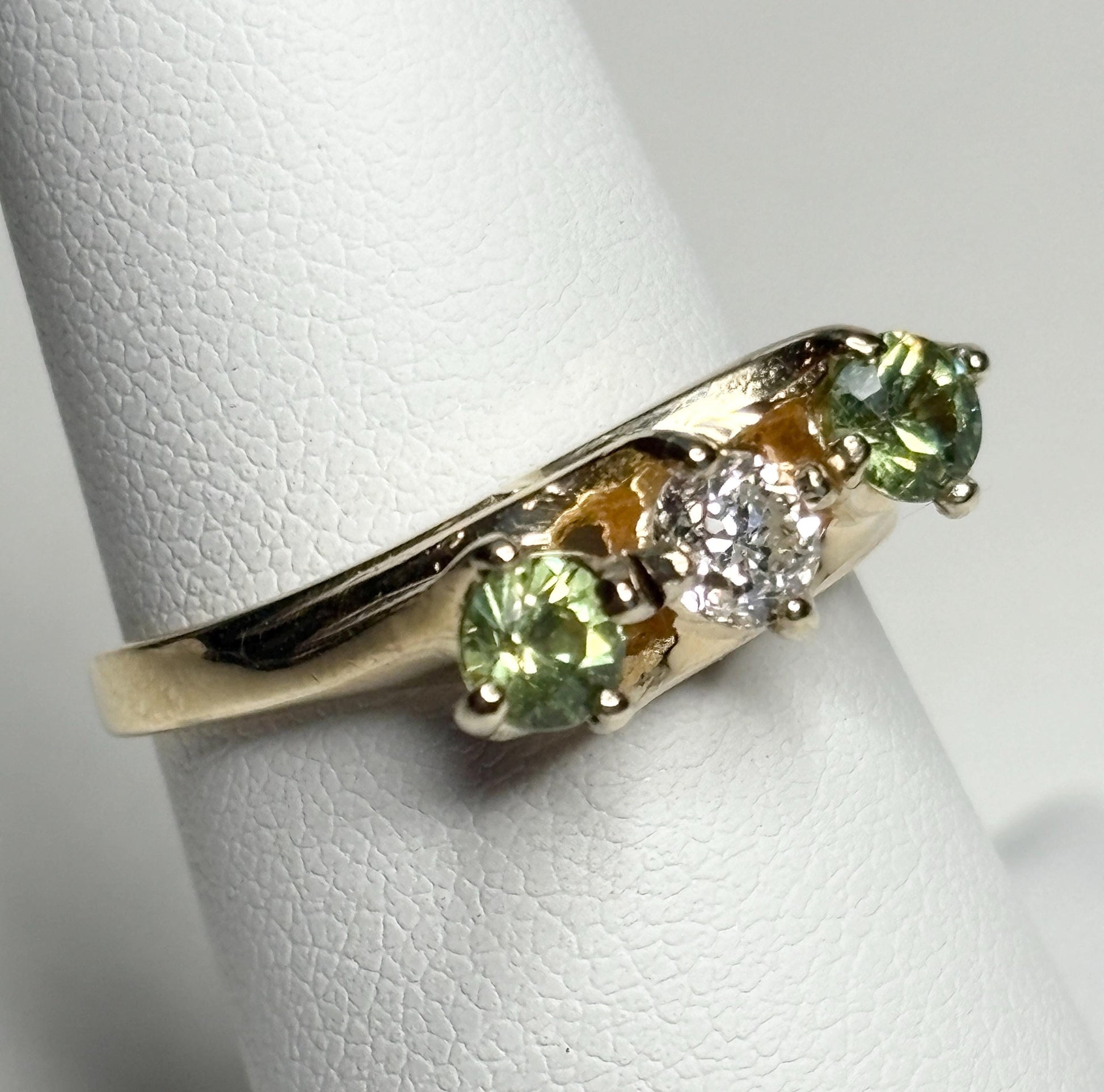 Vintage 10k gold ring with a diamond and two demantoid garnets.