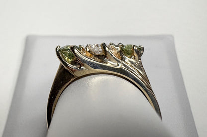 Vintage 10k gold ring with a European cut diamond and two demantoid garnets.