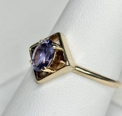 Geometric 10k gold ring with an oval iolite solitaire.