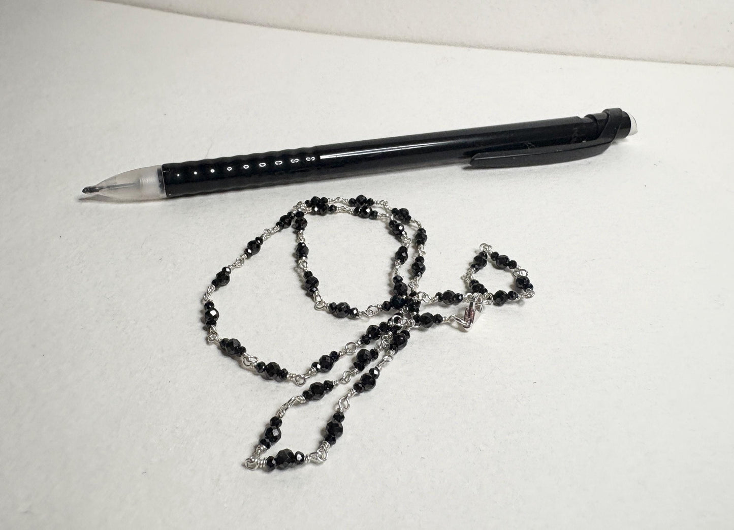 Sterling silver necklace with 2-3mm faceted black diamond beads.