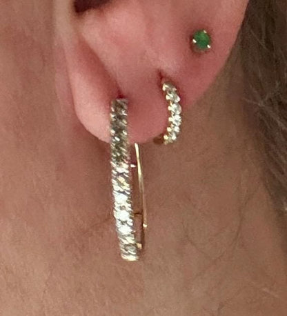 Hoop earrings with channel-set brown diamonds in 10k gold.