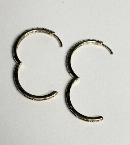 Hoop earrings with channel-set brown diamonds in 10k gold.