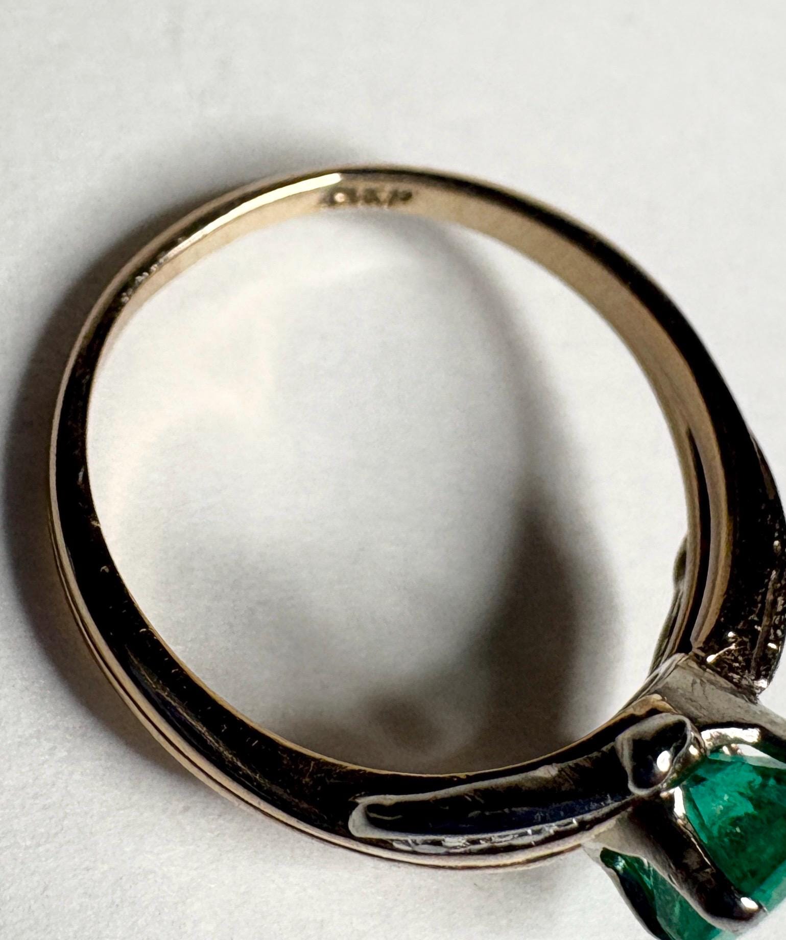 Vintage 14k gold ring with emerald and single cut diamonds.
