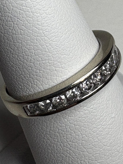 A white gold anniversary band ring with channel-set diamonds.