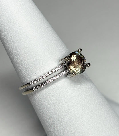 A bicolor Oregon sunstone ring with diamonds in white gold.