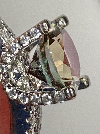 An Oregon Sunstone ring with diamonds in 18k white gold.