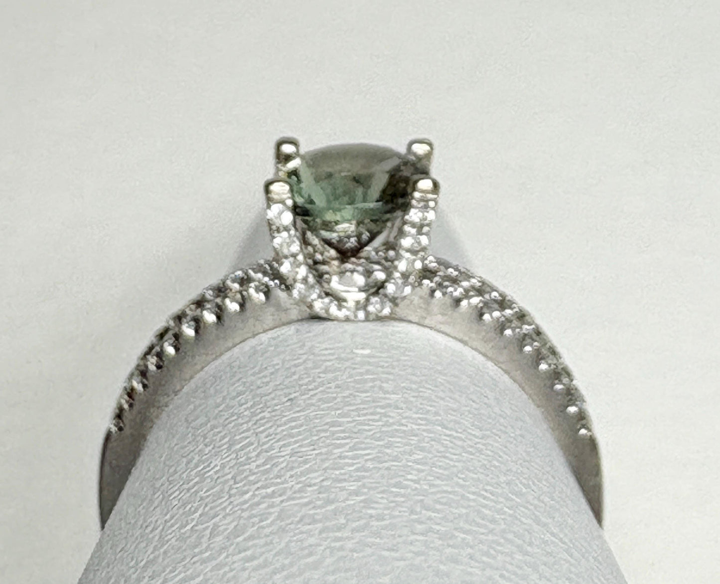 An 18k white gold ring with a bicolor Oregon sunstone and .20ctw diamonds.