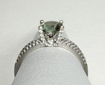 An 18k white gold ring with a bicolor Oregon sunstone and .20ctw diamonds.
