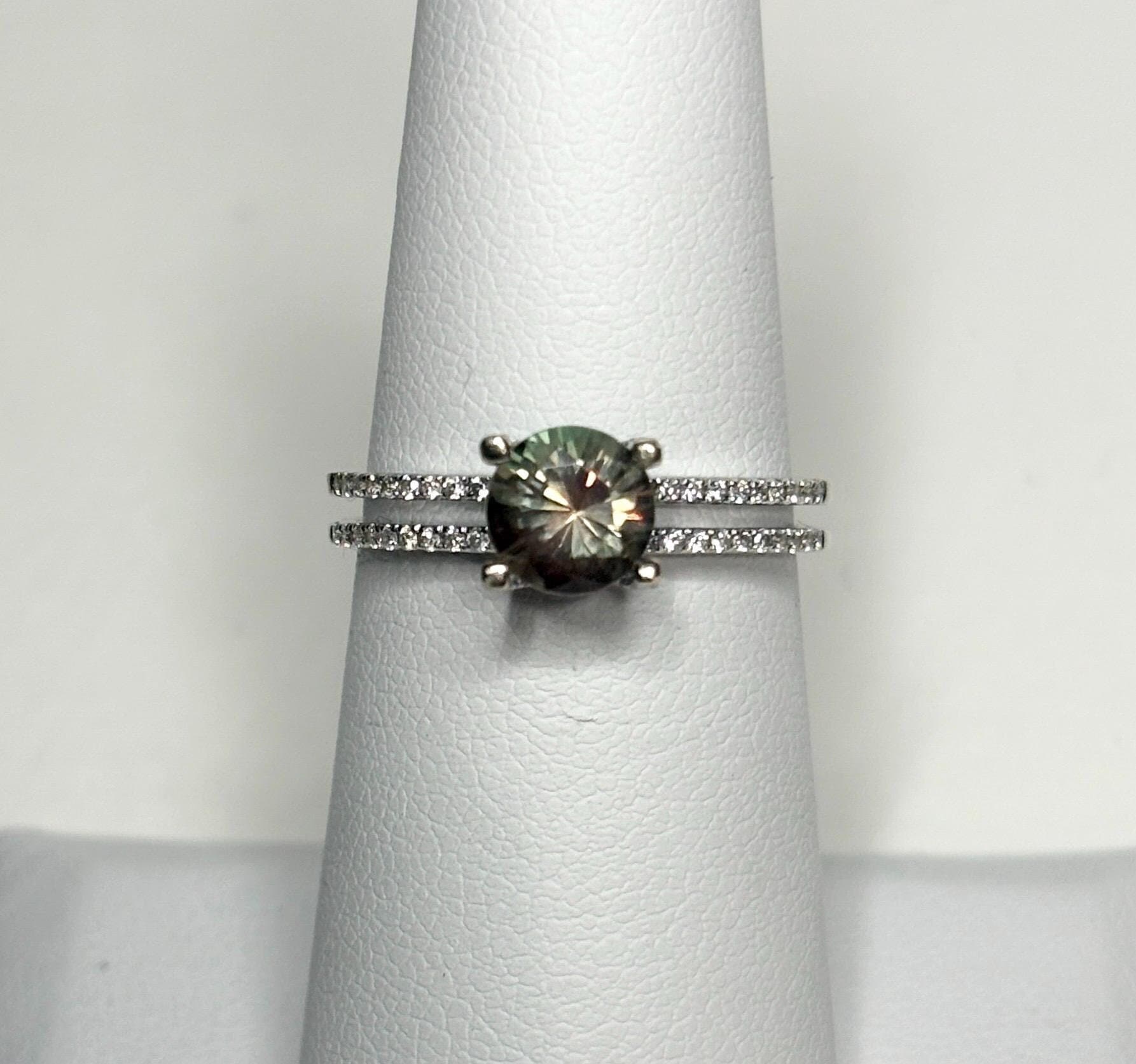 A bicolor Oregon sunstone ring with diamonds in 18k white gold.