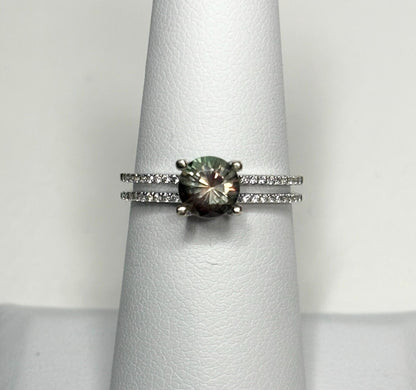 A bicolor Oregon sunstone ring with diamonds in 18k white gold.