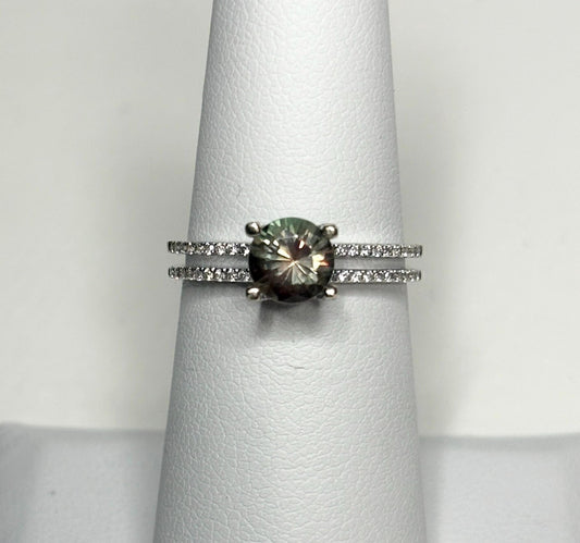 A bicolor Oregon sunstone ring with diamonds in 18k white gold.
