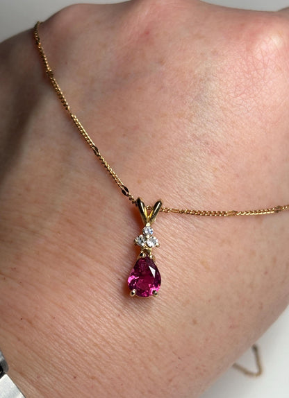 14k gold necklace with a pear-shaped rubellite tourmaline and diamond pendant.