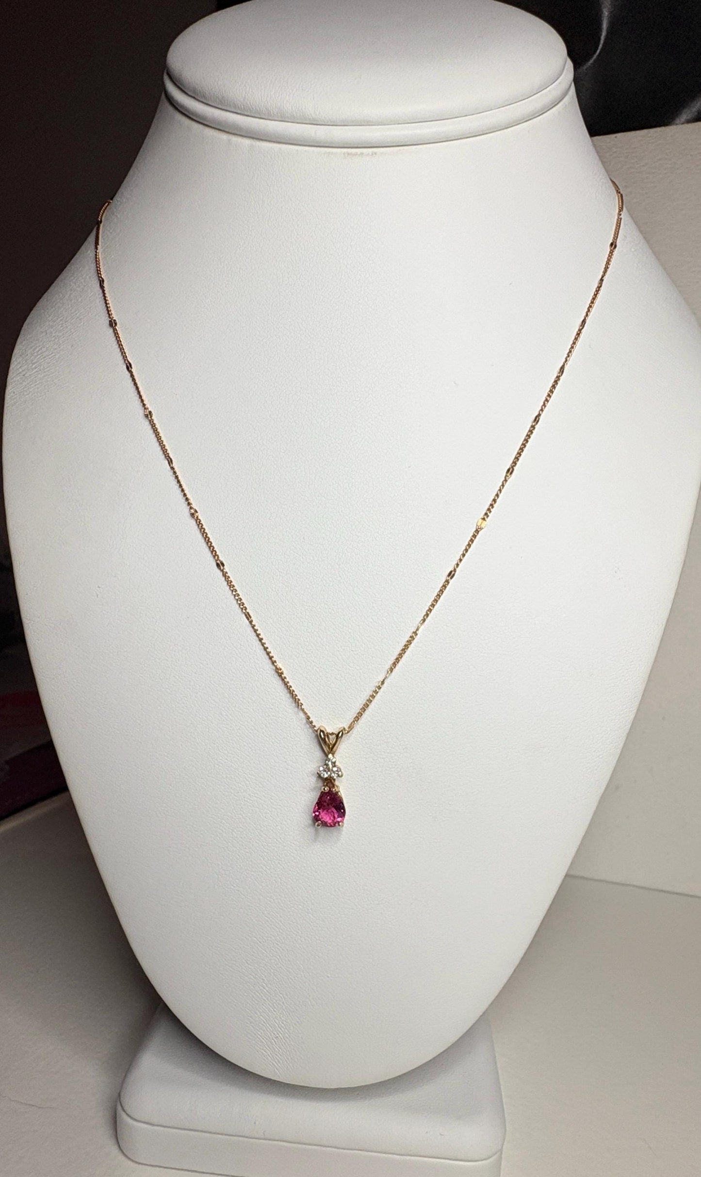 14k gold necklace with a pear-shaped rubellite tourmaline and diamond pendant.
