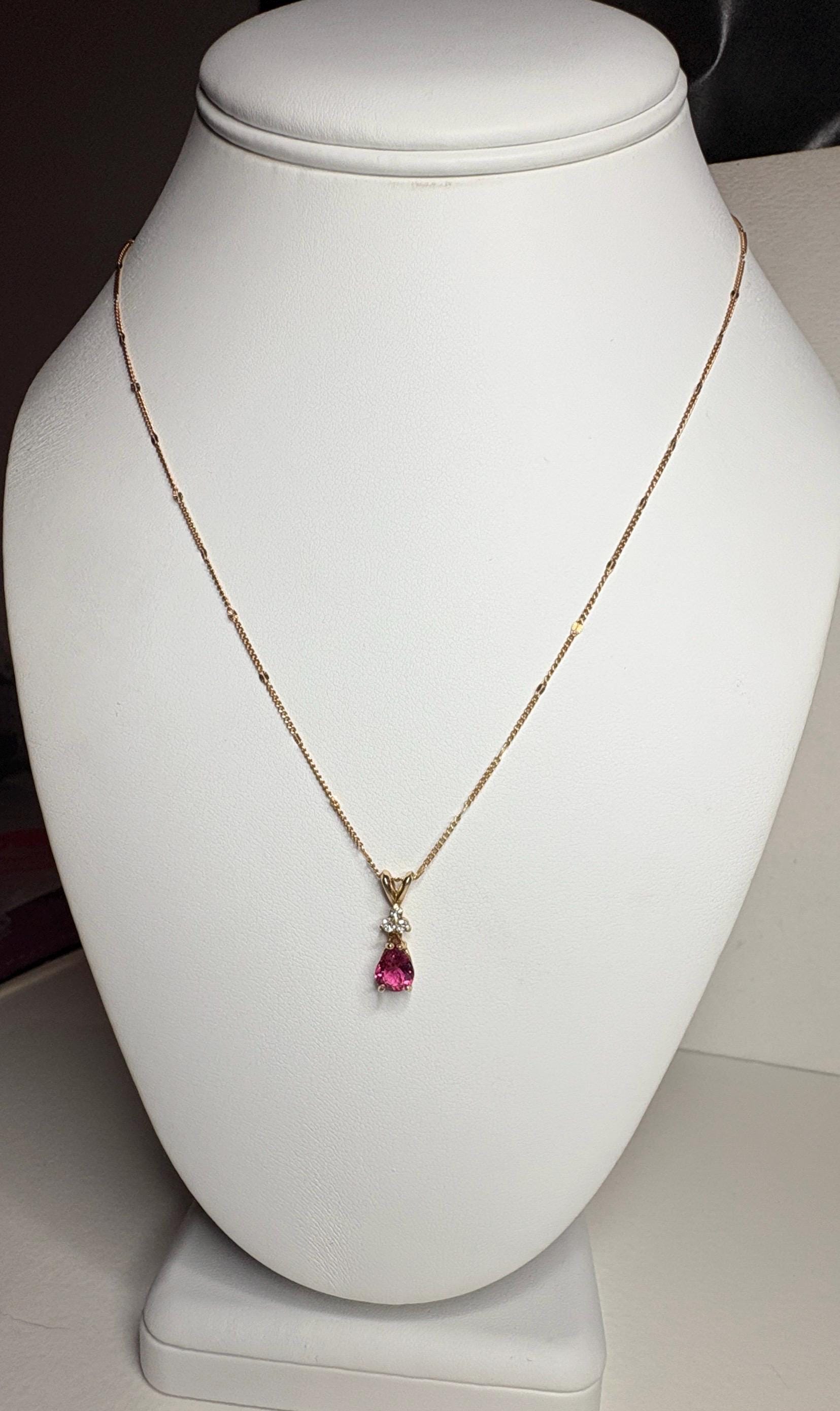 14k gold necklace with a pear-shaped rubellite tourmaline and diamond pendant.