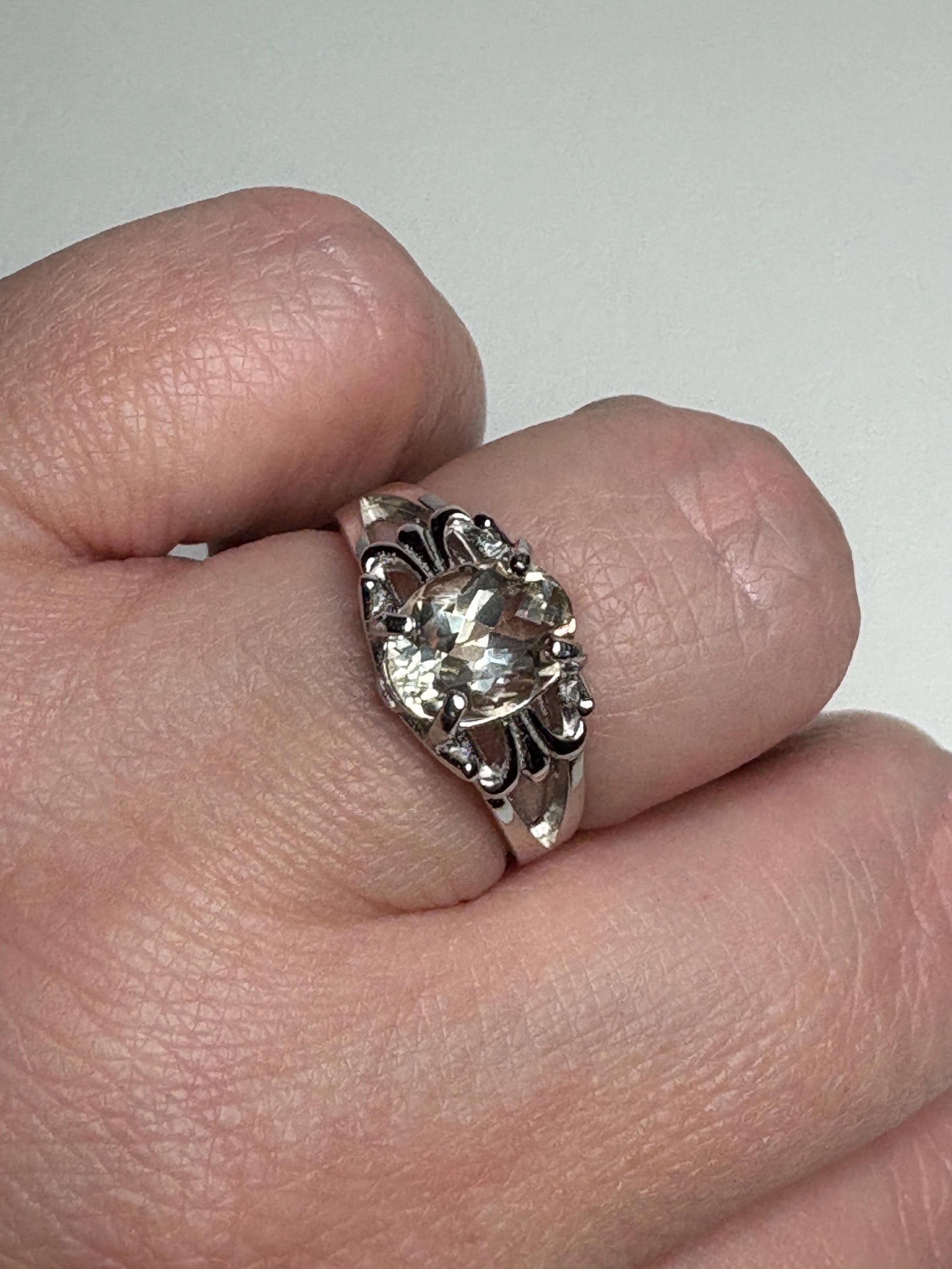 Sterling silver ring with a yellow Oregon sunstone in a fleur de lis design.