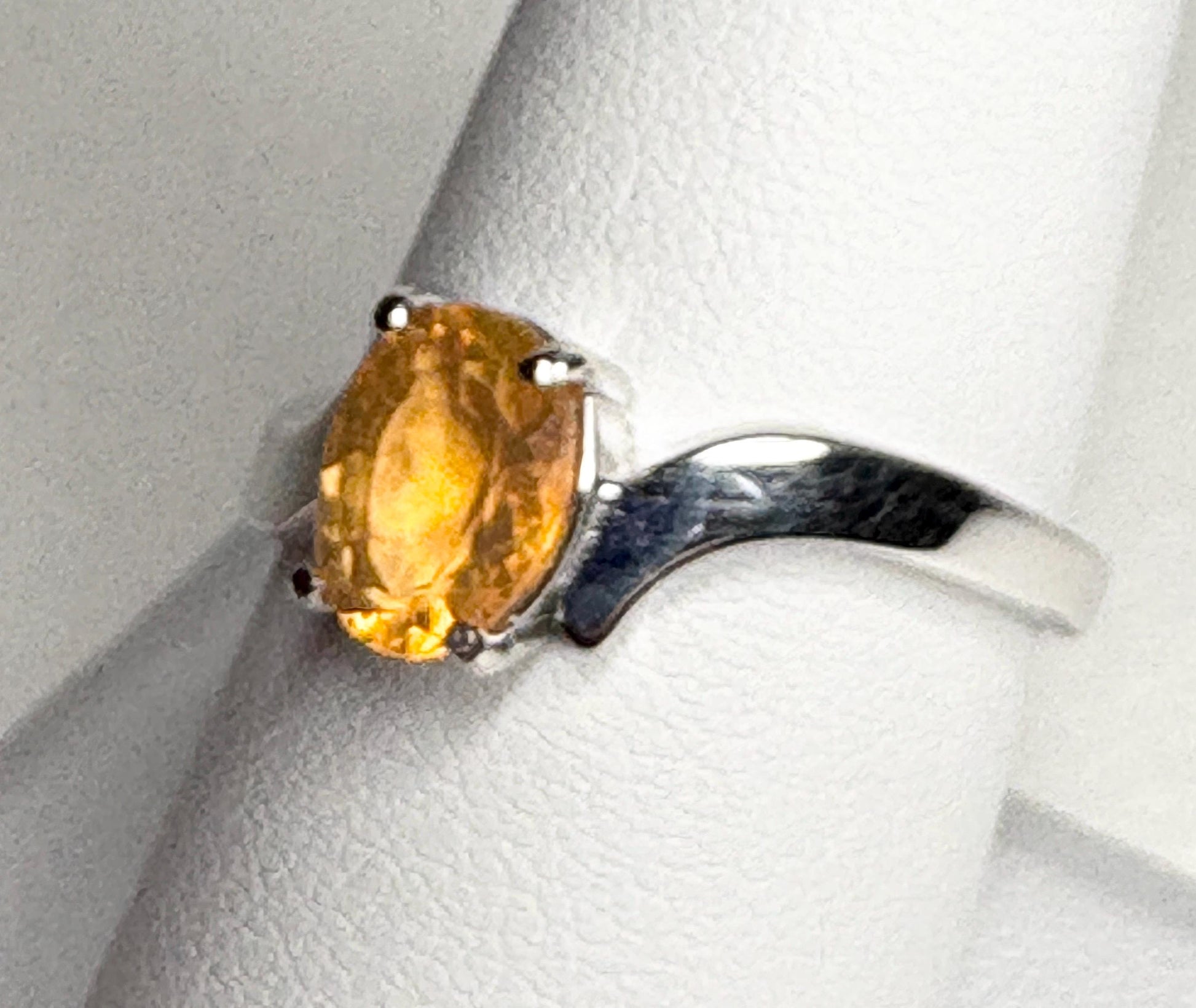 Sterling silver bypass ring with an oval Brazilian fire opal.