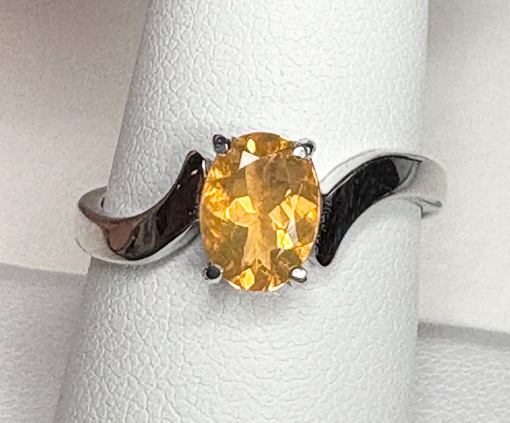 Sterling silver bypass ring with an oval Brazilian fire opal.