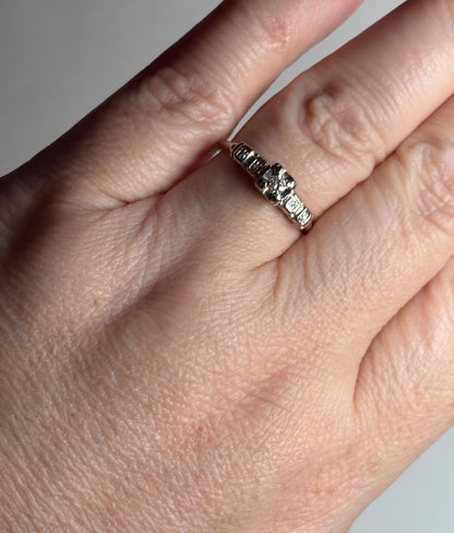 Vintage 14k gold two-tone engagement ring with small diamonds.