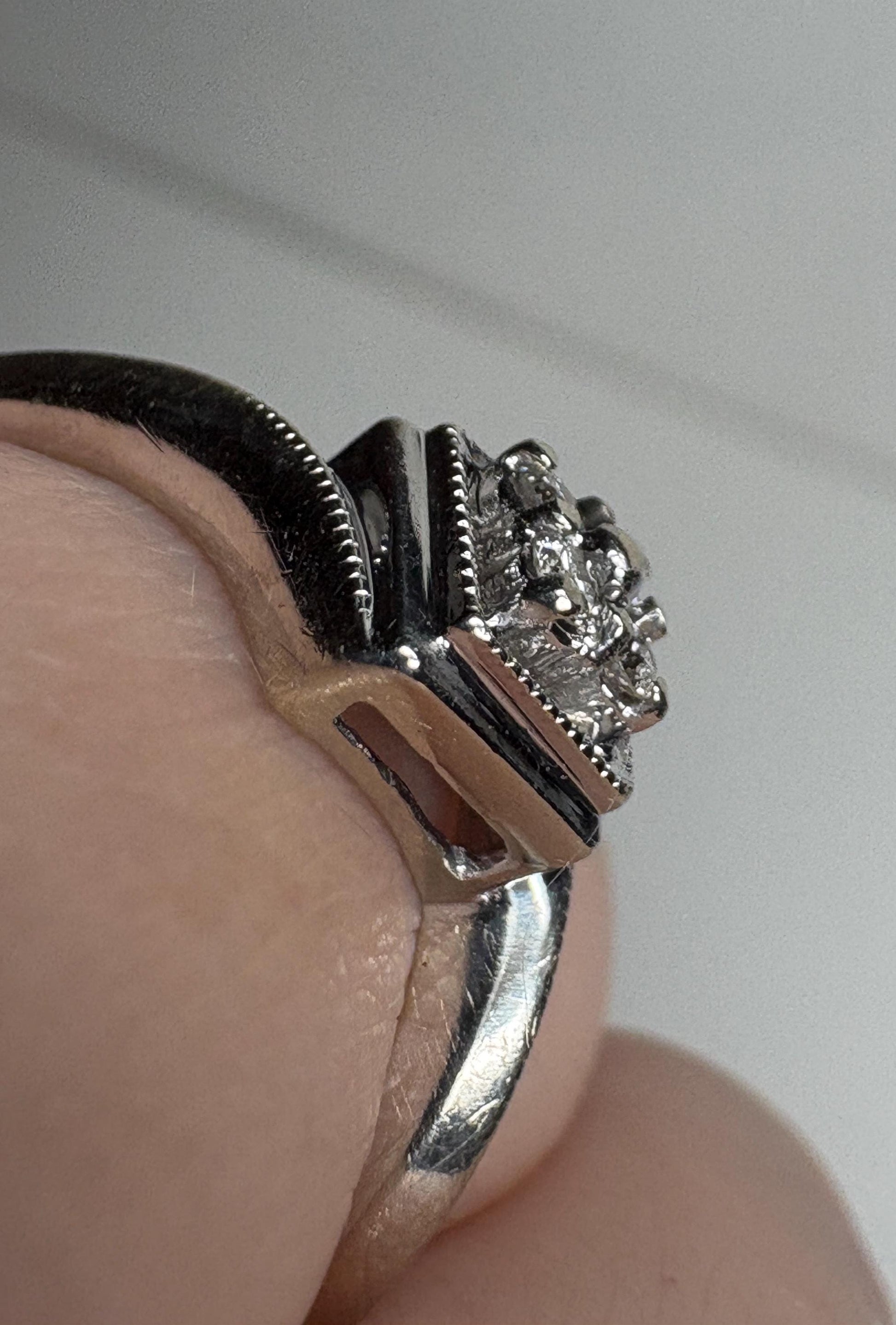 10k white gold ring with a square cluster of natural diamonds and milgrain detailing.