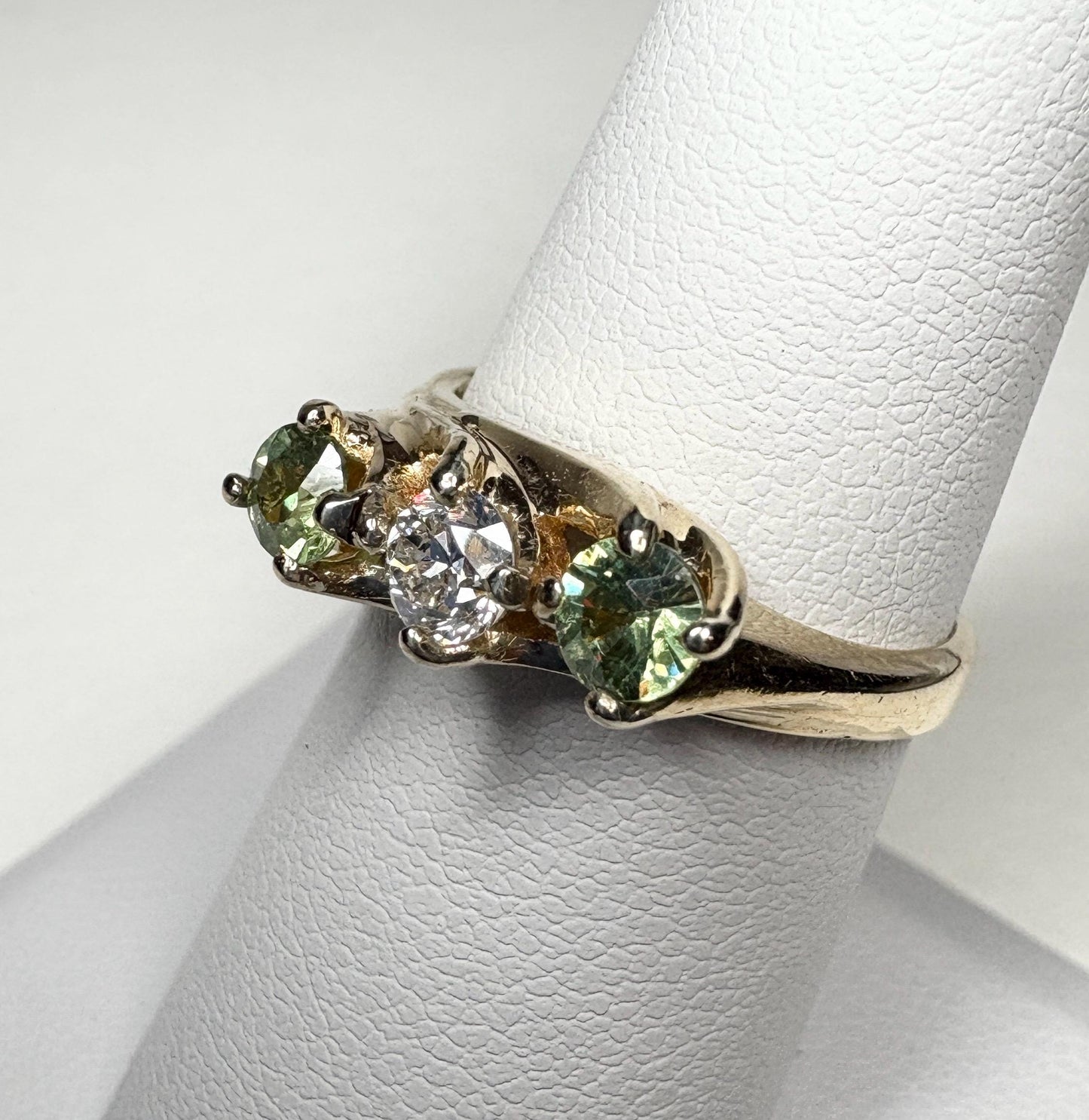 Vintage 10k gold ring with a diamond and two demantoid garnets.