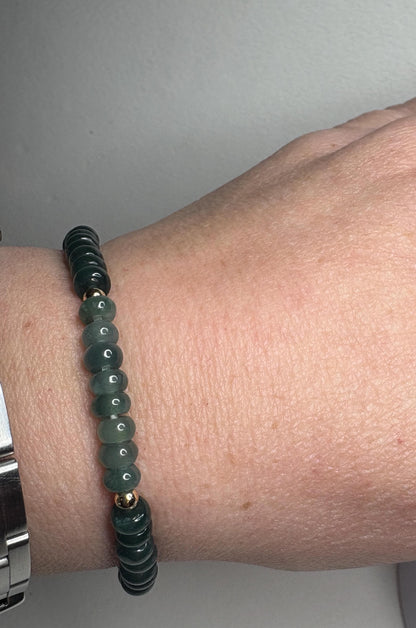 Guatemalan Type A jadeite jade stretch bracelet with gold beads.