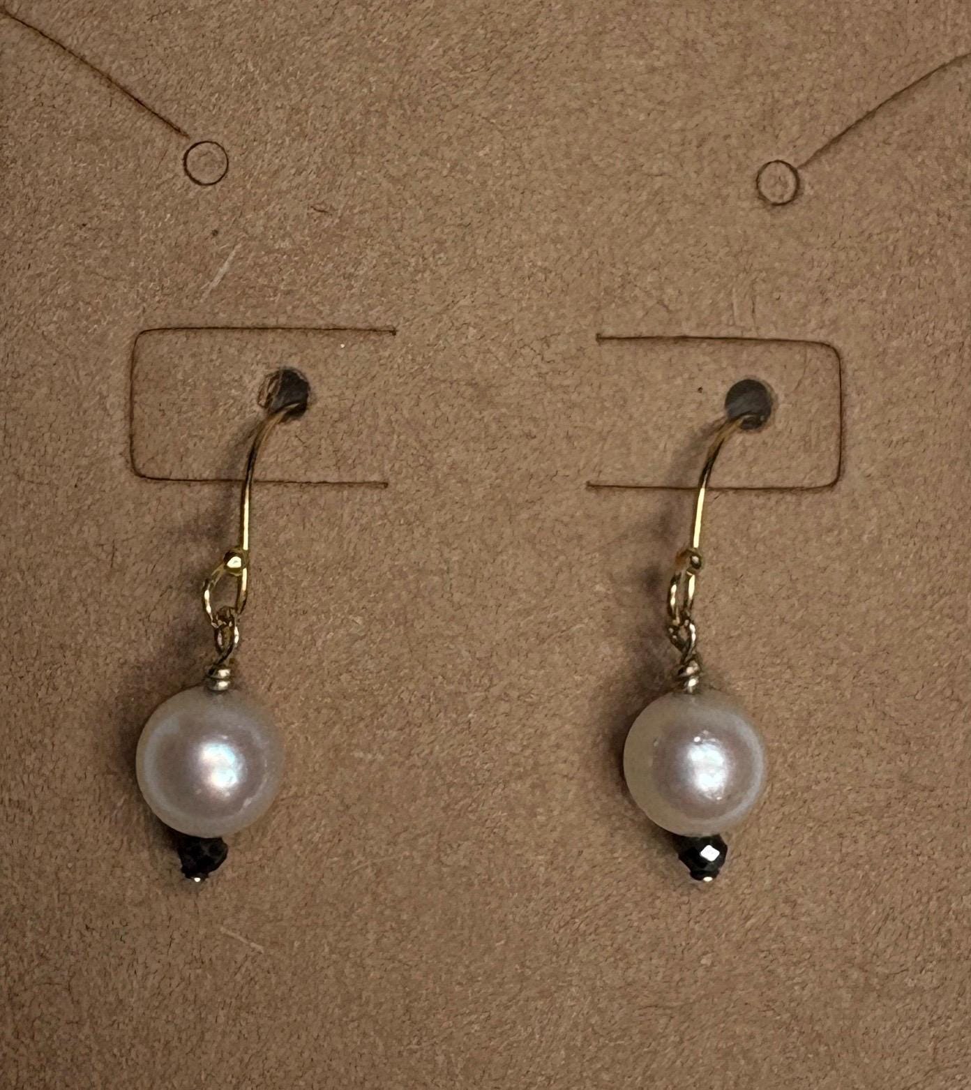 14k gold dangle earrings with Akoya pearls and black diamond beads.