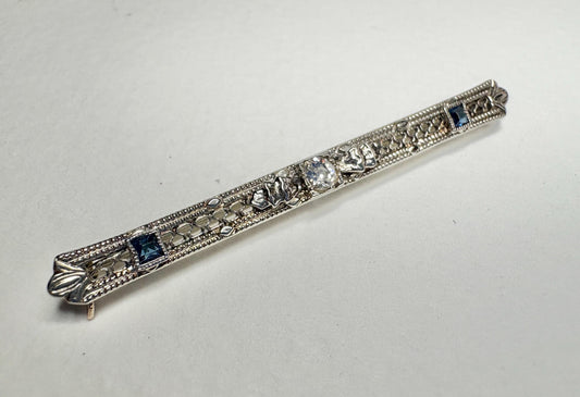 Antique 10k white gold bar brooch with diamond and simulated sapphires.