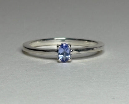 Sterling silver ring with a 5x3mm oval tanzanite gemstone.