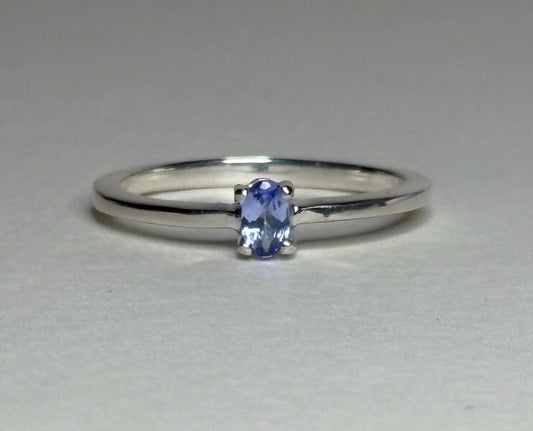 Sterling silver ring with a 5x3mm oval tanzanite gemstone.