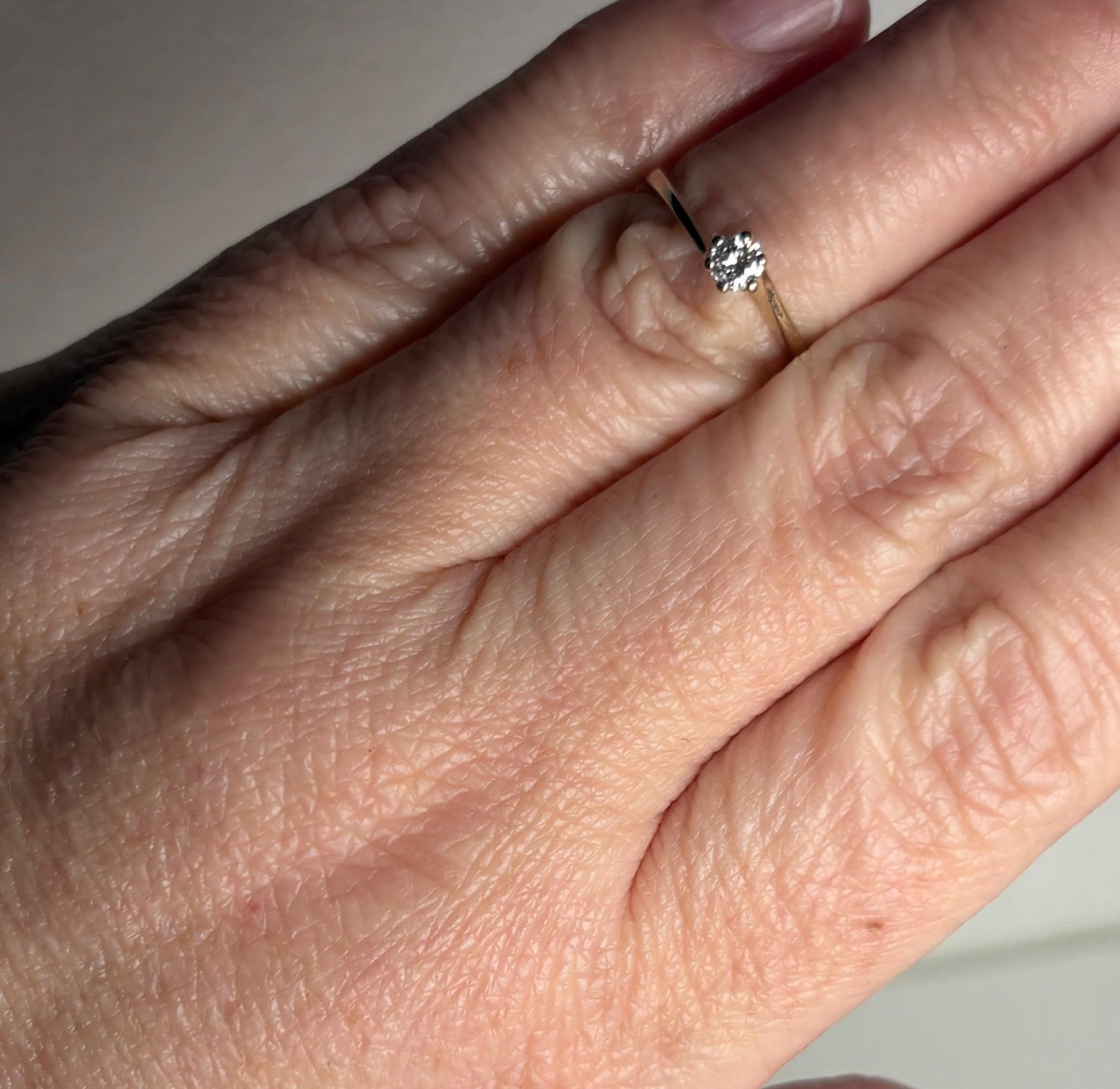 14k gold ring with a .15ct natural diamond solitaire.