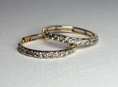 10k gold hoop earrings with channel-set brown diamonds.