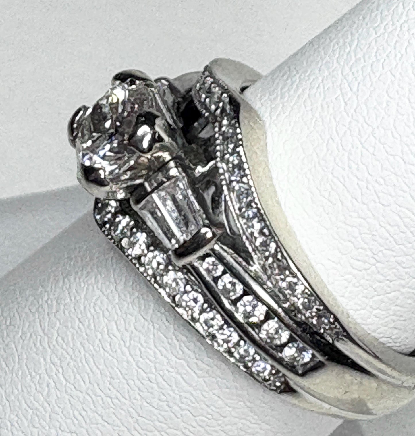 14k white gold ring with baguette and round diamonds.