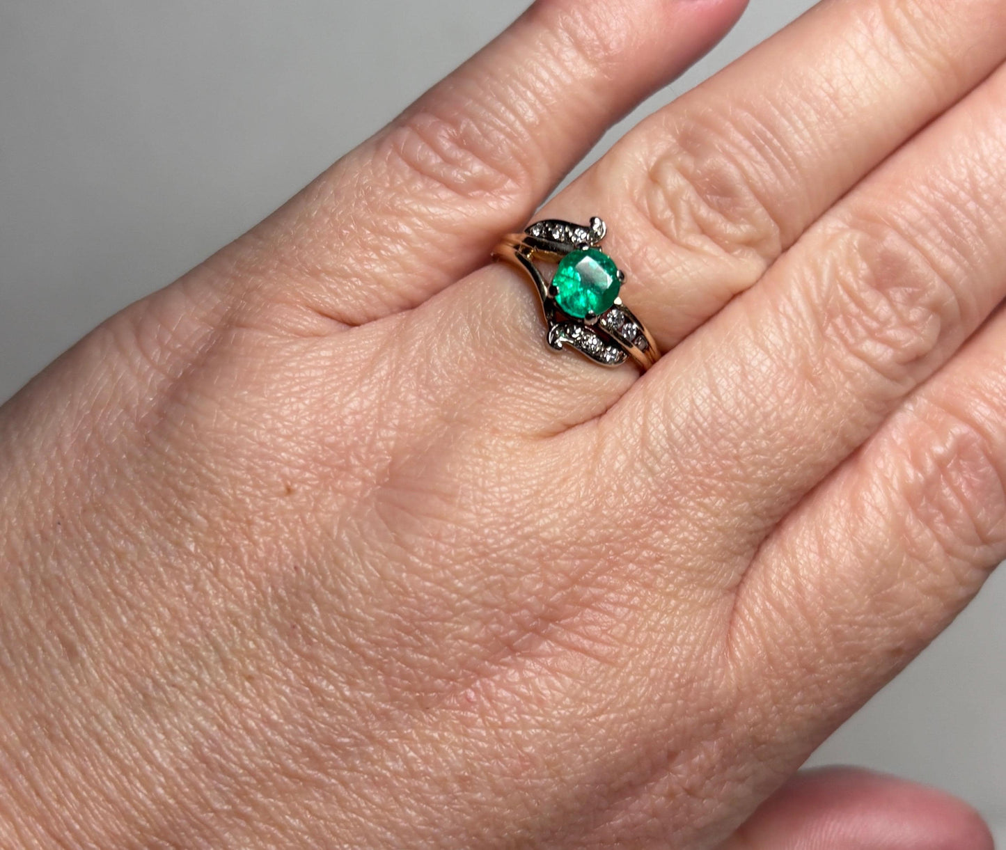 Vintage 14k gold ring with emerald and single cut diamonds.
