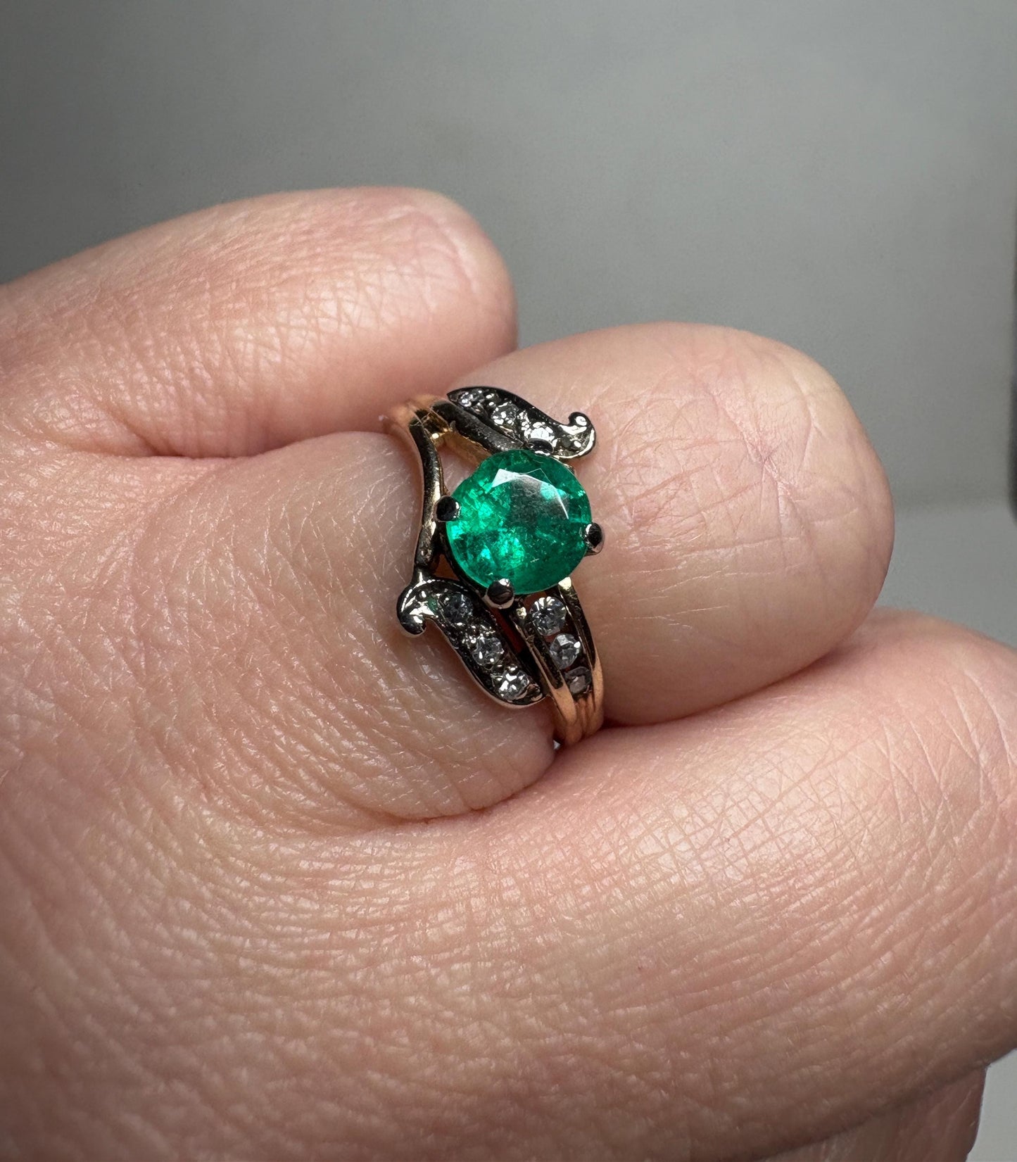 Vintage 14k gold ring with emerald and single cut diamonds.