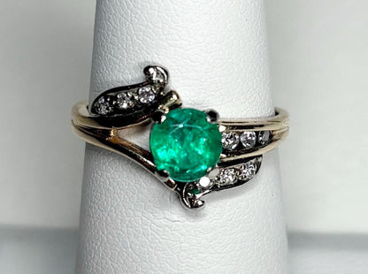Vintage 14k gold ring with emerald and single cut diamonds.