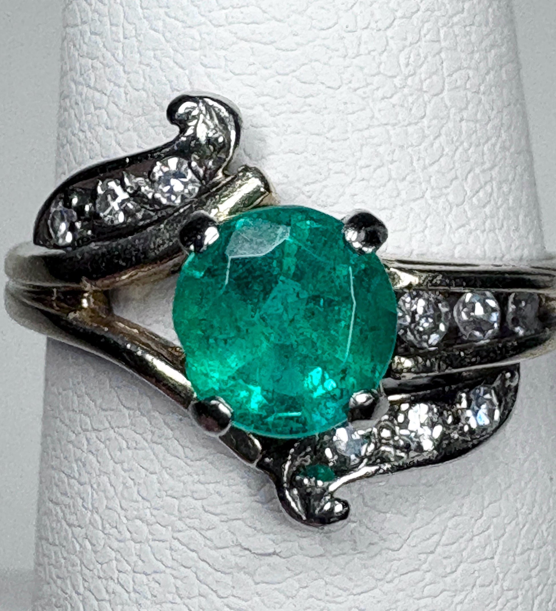 Vintage 14k gold ring with a free-form design, featuring an emerald and single cut diamonds.