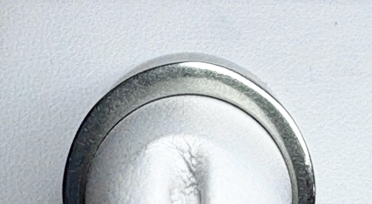 A white gold anniversary band ring with channel-set diamonds.