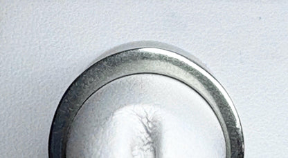 A white gold anniversary band ring with channel-set diamonds.