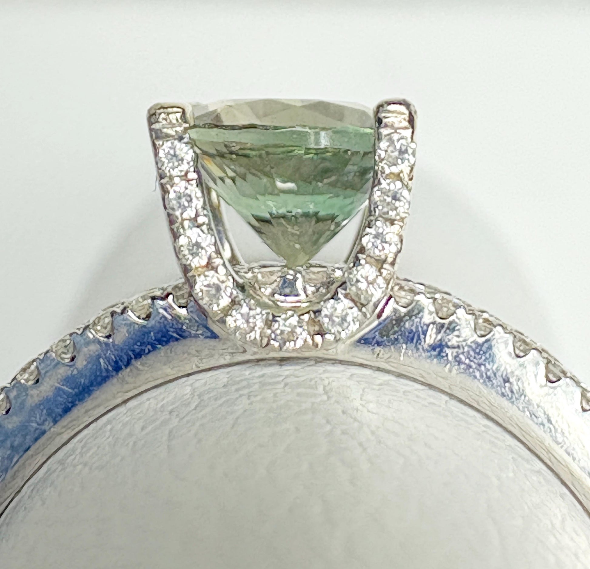 18k white gold ring with a bicolor Oregon sunstone and diamonds.