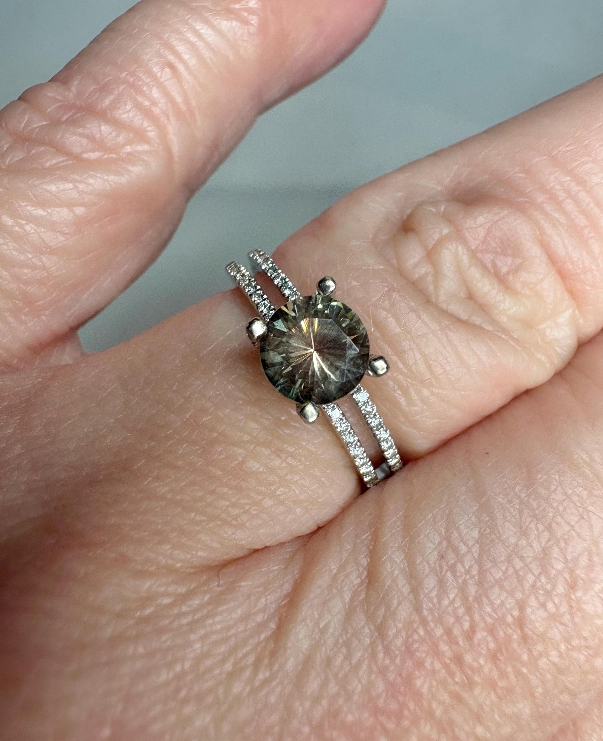 A bicolor Oregon sunstone ring with diamonds in 18k white gold.