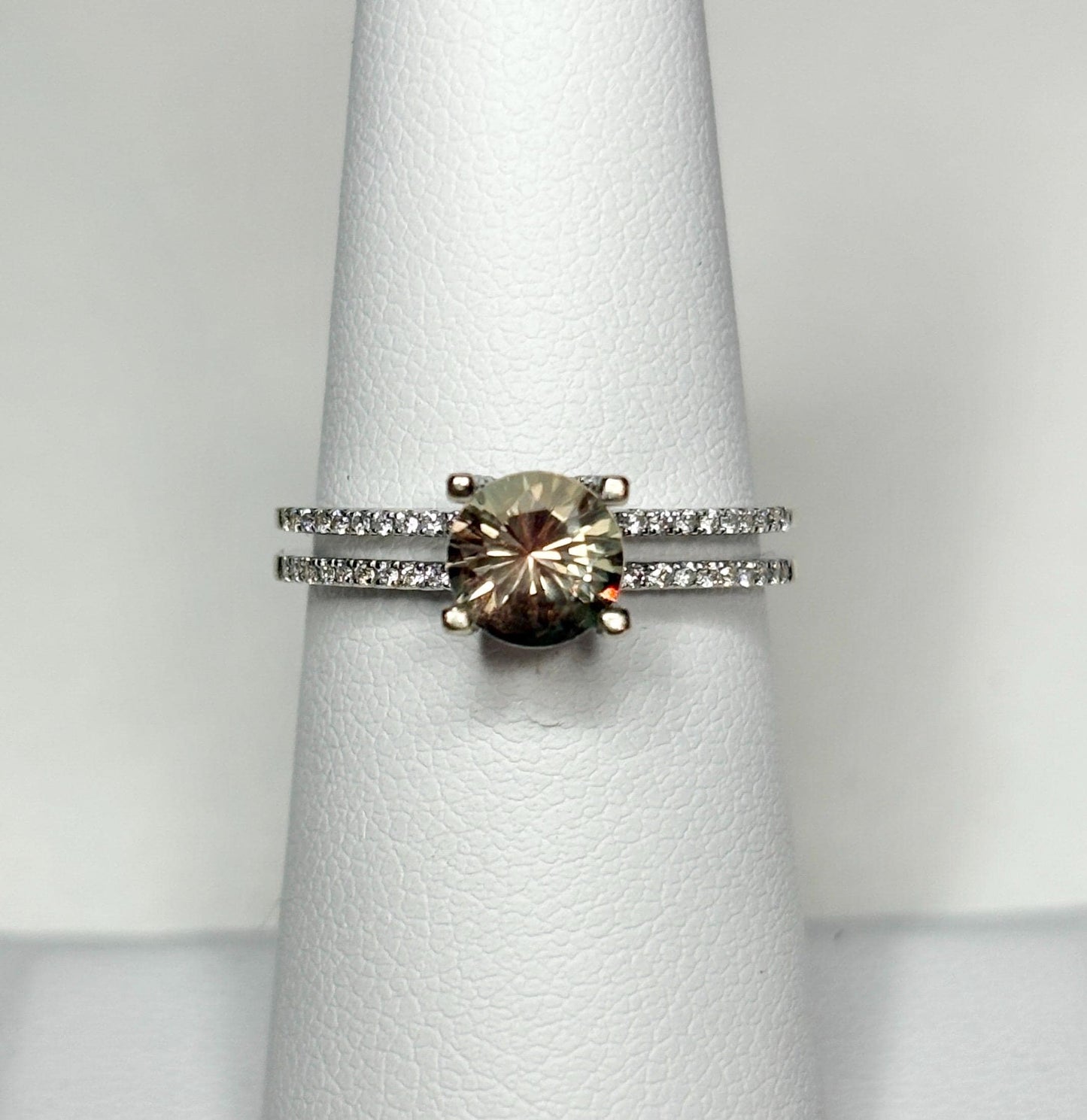 A bicolor Oregon sunstone ring with diamonds in 18k white gold.