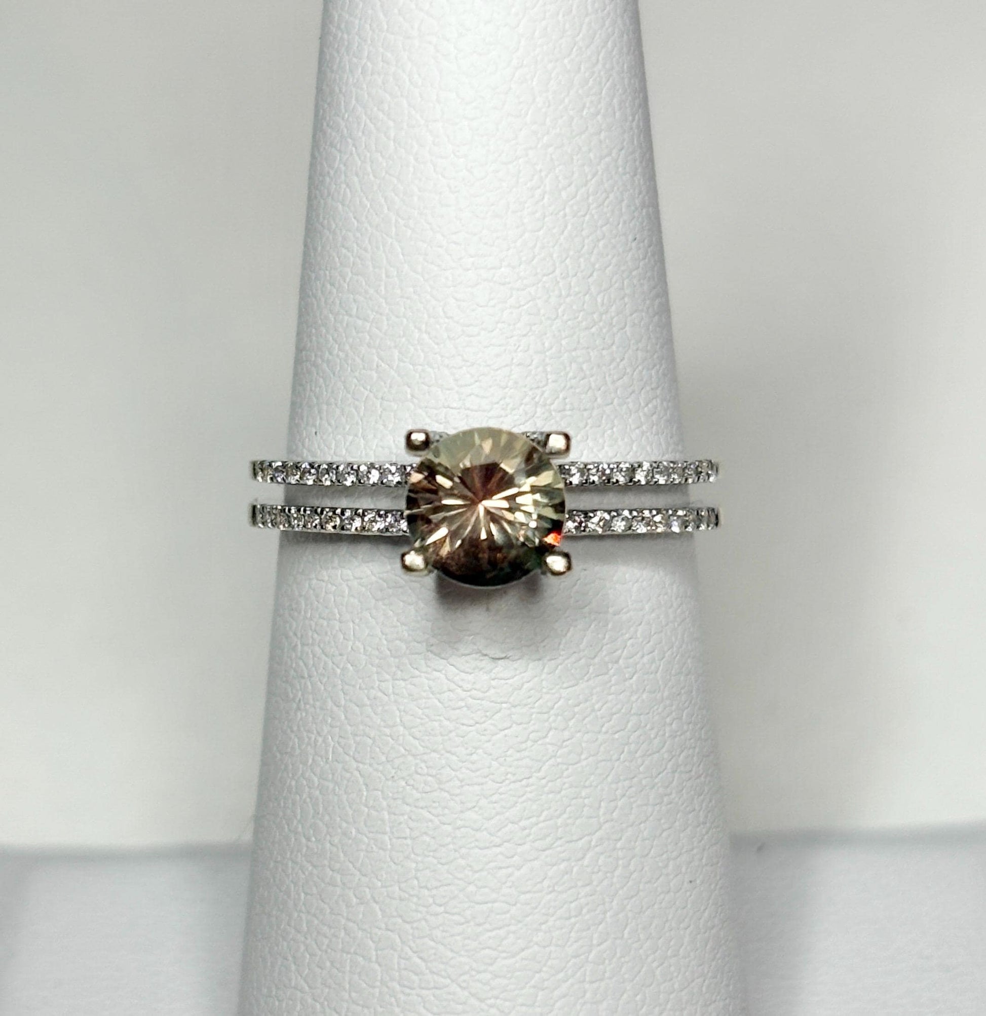 A bicolor Oregon sunstone ring with diamonds in 18k white gold.